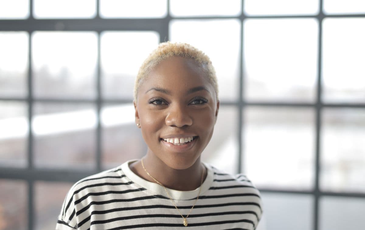 A person smiling confidently after orthodontic treatment