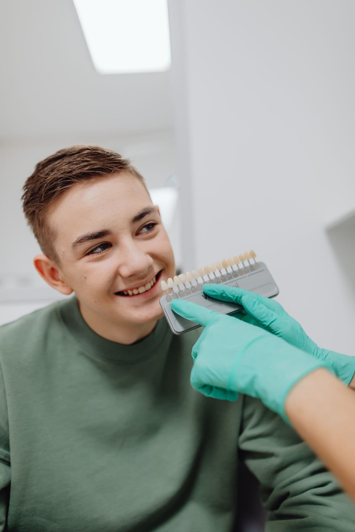 A smiling patient at a friendly dental checkup