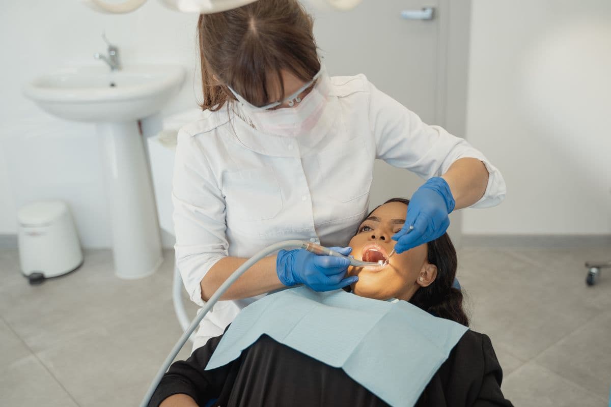 A dental hygienist performing a gentle cleaning